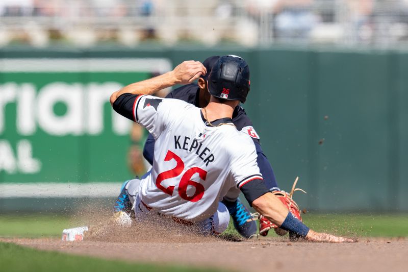 Apr 6, 2024; Minneapolis, Minnesota, USA; Minnesota Twins right fielder Max Kepler (26) is called out at second by Cleveland Guardians second base Andres Gimenez (0) in the sixth inning at Target Field. Mandatory Credit: Matt Blewett-USA TODAY Sports