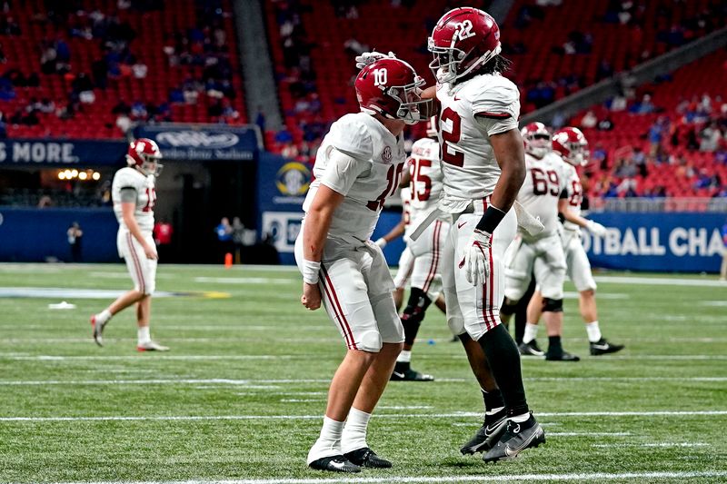 Dec 19, 2020; Atlanta, Georgia, USA; Alabama Crimson Tide running back Najee Harris (22) celebrates with quarterback Mac Jones (10) after scoring a touchdown during the second quarter against the Florida Gators in the SEC Championship at Mercedes-Benz Stadium. Mandatory Credit: Dale Zanine-USA TODAY Sports