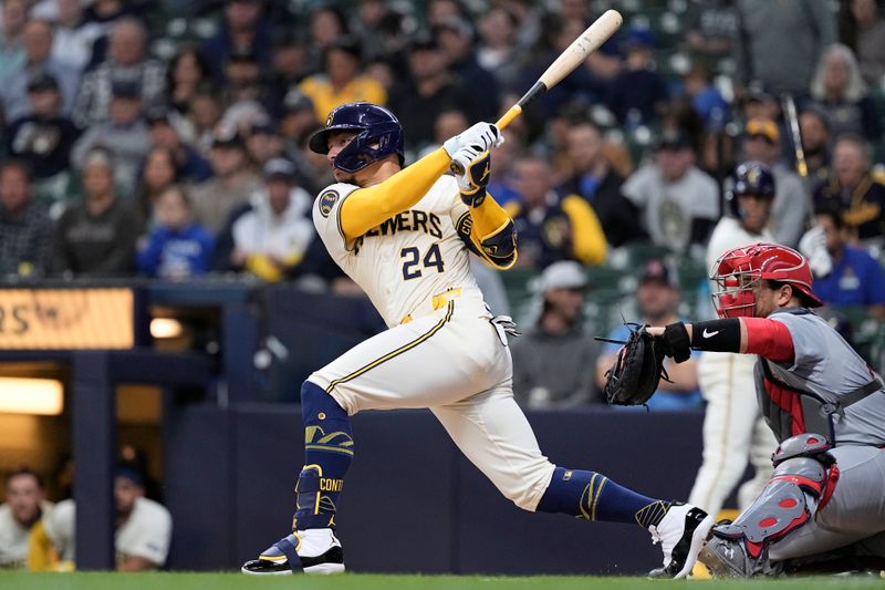 May 9, 2024; Milwaukee, Wisconsin, USA;  Milwaukee Brewers designated hitter William Contreras (24) hits a single during the first inning against the St. Louis Cardinals at American Family Field. Mandatory Credit: Jeff Hanisch-USA TODAY Sports