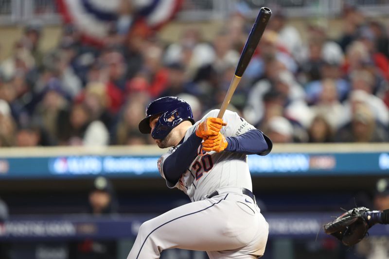 Oct 11, 2023; Minneapolis, Minnesota, USA; Houston Astros center fielder Chas McCormick (20) hits a single in the fourth inning against the Minnesota Twins during game four of the ALDS for the 2023 MLB playoffs at Target Field. Mandatory Credit: Jesse Johnson-USA TODAY Sports