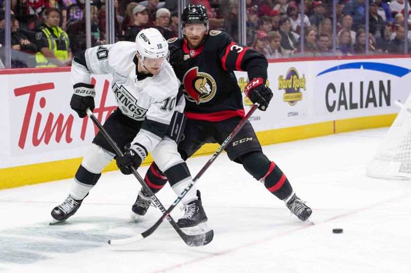 Oct 14, 2024; Ottawa, Ontario, CAN; Los Angeles Kings left wing Tanner Jeannot (10) moves the puck away from Ottawa Senators defenseman Nick Jensen (3) in the second period at the Canadian Tire Centre. Mandatory Credit: Marc DesRosiers-Imagn Images