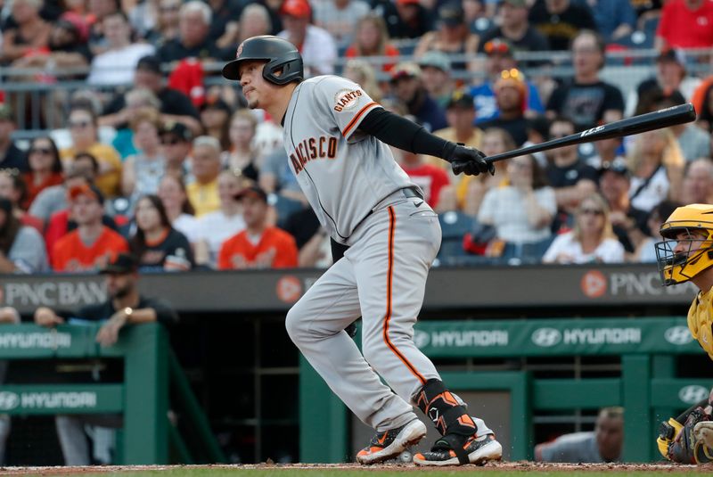 Jul 14, 2023; Pittsburgh, Pennsylvania, USA; San Francisco Giants first baseman Wilmer Flores (41) hits a single against the Pittsburgh Pirates during the third inning at PNC Park. Mandatory Credit: Charles LeClaire-USA TODAY Sports