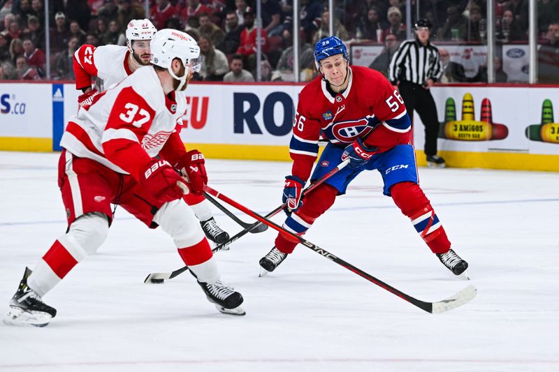 Dec 2, 2023; Montreal, Quebec, CAN; Montreal Canadiens right wing Jesse Ylonen (56) plays the puck against Detroit Red Wings left wing J.T. Compher (37) during the third period at Bell Centre. Mandatory Credit: David Kirouac-USA TODAY Sports