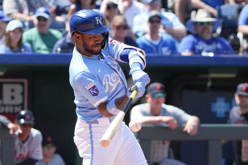 May 22, 2024; Kansas City, Missouri, USA; Kansas City Royals third baseman Maikel Garcia (11) hits a single against the Detroit Tigers in the seventh inning at Kauffman Stadium. Mandatory Credit: Denny Medley-USA TODAY Sports