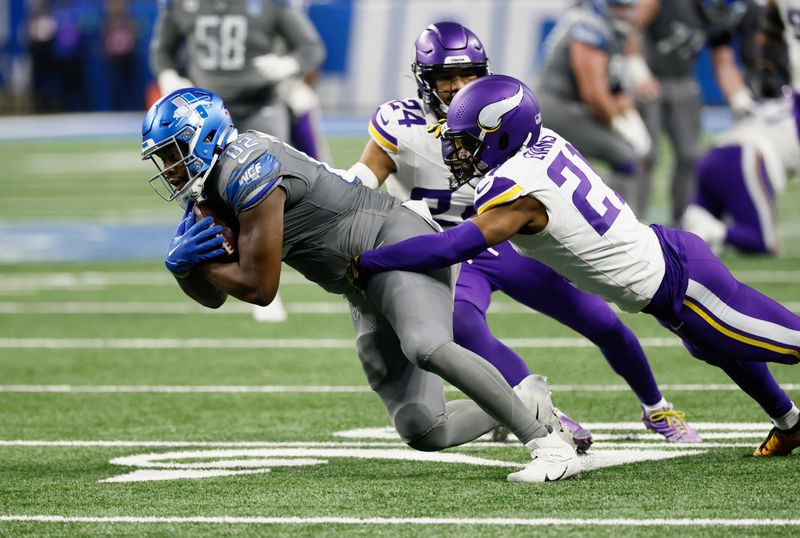 Detroit Lions tight end James Mitchell (82) is tackled by Minnesota Vikings cornerback Akayleb Evans (21) during the second half of an NFL football game Sunday, Jan. 7, 2024, in Detroit. (AP Photo/Duane Burleson)