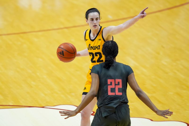 Feb 22, 2024; Bloomington, Indiana, USA;  Iowa Hawkeyes guard Caitlin Clark (22) dribbles the ball as she gestures to teammates in the game against the Indiana Hoosiers in the second half at Simon Skjodt Assembly Hall. Mandatory Credit: Aaron Doster-USA TODAY Sports