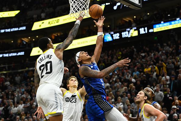 SALT LAKE CITY, UTAH - NOVEMBER 02: Paolo Banchero #5 of the Orlando Magic shoots under John Collins #20 of the Utah Jazz during the second half of a game at Delta Center on November 02, 2023 in Salt Lake City, Utah. NOTE TO USER: User expressly acknowledges and agrees that, by downloading and or using this photograph, User is consenting to the terms and conditions of the Getty Images License Agreement.  (Photo by Alex Goodlett/Getty Images)