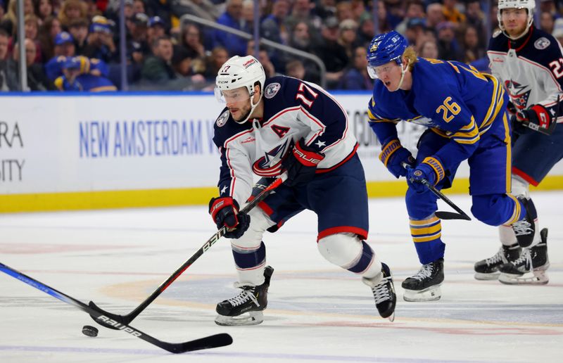 Dec 30, 2023; Buffalo, New York, USA;  Columbus Blue Jackets right wing Justin Danforth (17) skates up ice with the puck during the third period against the Buffalo Sabres at KeyBank Center. Mandatory Credit: Timothy T. Ludwig-USA TODAY Sports