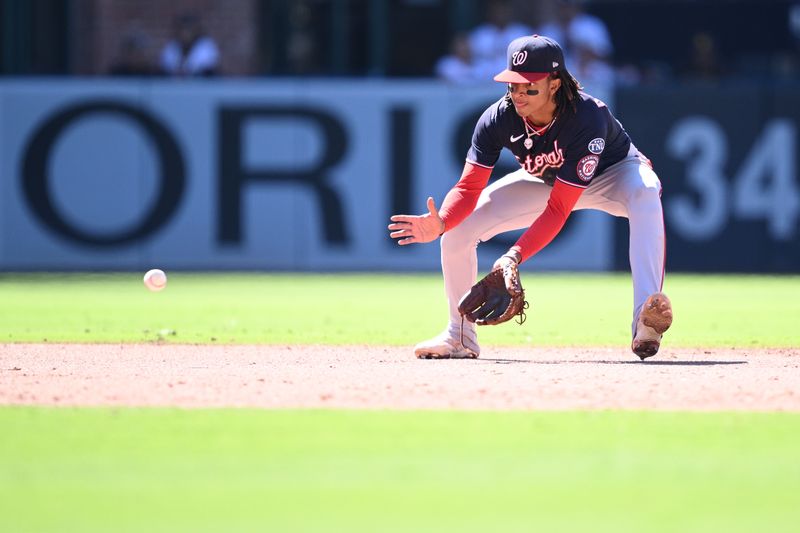 Jun 25, 2023; San Diego, California, USA; Washington Nationals shortstop C.J. Abrams (5) fields a ground ball hit by San Diego Padres designated hitter Nelson Cruz (not pictured) during the eighth inning at Petco Park. Mandatory Credit: Orlando Ramirez-USA TODAY Sports