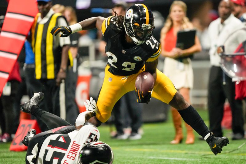 Pittsburgh Steelers running back Najee Harris runs over Atlanta Falcons linebacker Mike Jones Jr. during the first half of a preseason NFL football game Thursday, Aug. 24, 2023, in Atlanta. (AP Photo/Gerald Herbert)