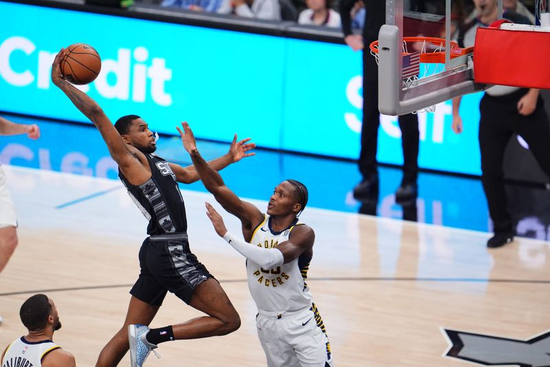 SAN ANTONIO, TX - MARCH 3: Blake Wesley #14 of the San Antonio Spurs dunks the ball during the game against the Indiana Pacers on March 3, 2024 at the AT&T Center in San Antonio, Texas. NOTE TO USER: User expressly acknowledges and agrees that, by downloading and or using this photograph, user is consenting to the terms and conditions of the Getty Images License Agreement. Mandatory Copyright Notice: Copyright 2024 NBAE (Photos by Cooper Neill/NBAE via Getty Images)