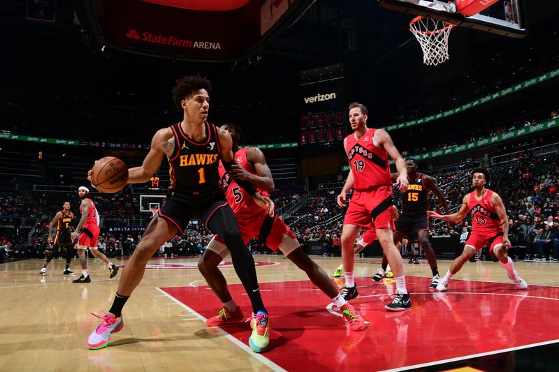 ATLANTA, GA - February 23: Jalen Johnson #1 of the Atlanta Hawks handles the ball during the game against the Toronto Raptors on February 23, 2024 at State Farm Arena in Atlanta, Georgia.  NOTE TO USER: User expressly acknowledges and agrees that, by downloading and/or using this Photograph, user is consenting to the terms and conditions of the Getty Images License Agreement. Mandatory Copyright Notice: Copyright 2024 NBAE (Photo by Scott Cunningham/NBAE via Getty Images)