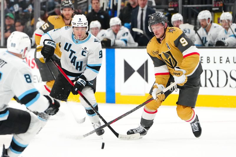 Mar 19, 2026; Las Vegas, Nevada, USA; Utah Mammoth right wing Clayton Keller (9) keeps the puck away from Vegas Golden Knights center Jack Eichel (9) during the second period at T-Mobile Arena. Mandatory Credit: Stephen R. Sylvanie-Imagn Images