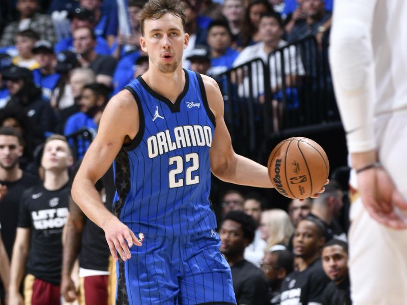 ORLANDO, FL - APRIL 25: Franz Wagner #22 of the Orlando Magic handles the ball during the game  against the Cleveland Cavaliers during Round 1 Game 3 of the 2024 NBA Playoffs on April 25, 2024 at Kia Center in Orlando, Florida. NOTE TO USER: User expressly acknowledges and agrees that, by downloading and or using this photograph, User is consenting to the terms and conditions of the Getty Images License Agreement. Mandatory Copyright Notice: Copyright 2023 NBAE (Photo by Fernando Medina/NBAE via Getty Images)