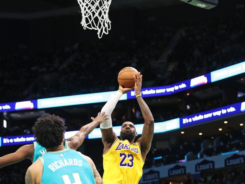 CHARLOTTE, NC - FEBRUARY 5: LeBron James #23 of the Los Angeles Lakers shoots the ball during the game  against the Charlotte Hornets on February 5, 2024 at Spectrum Center in Charlotte, North Carolina. NOTE TO USER: User expressly acknowledges and agrees that, by downloading and or using this photograph, User is consenting to the terms and conditions of the Getty Images License Agreement.  Mandatory Copyright Notice:  Copyright 2024 NBAE (Photo by Brock Williams-Smith/NBAE via Getty Images)