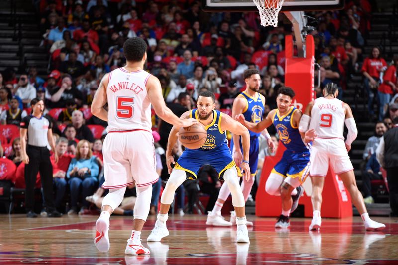 HOUSTON, TX - APRIL 4: Stephen Curry #30 of the Golden State Warriors plays defense against Fred VanVleet #5 of the Houston Rockets during the game on April 4, 2024 at the Toyota Center in Houston, Texas. NOTE TO USER: User expressly acknowledges and agrees that, by downloading and or using this photograph, User is consenting to the terms and conditions of the Getty Images License Agreement. Mandatory Copyright Notice: Copyright 2024 NBAE (Photo by Logan Riely/NBAE via Getty Images)