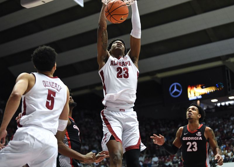 Feb 18, 2023; Tuscaloosa, Alabama, USA;  Alabama forward Nick Pringle (23) slams home a dunk against Georgia at Coleman Coliseum. Mandatory Credit: Gary Cosby Jr.-USA TODAY Sports