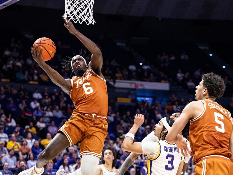 Feb 1, 2025; Baton Rouge, Louisiana, USA;  LSU Tigers forward Robert Miller III (6) drives to the basket against LSU Tigers guard Curtis Givens III (3) during the second half at Pete Maravich Assembly Center. Mandatory Credit: Stephen Lew-Imagn Images