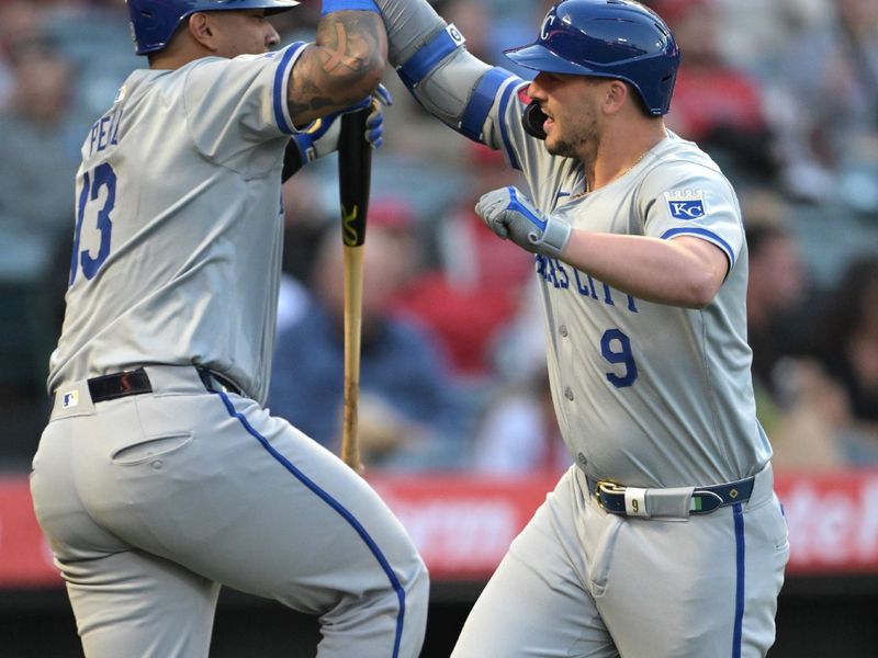 May 9, 2024; Anaheim, California, USA;  Kansas City Royals first baseman Vinnie Pasquantino (9) celebrates with catcher Salvador Perez (13) after hitting a two-run home run against the Los Angeles Angels in the third inning at Angel Stadium. Mandatory Credit: Jayne Kamin-Oncea-USA TODAY Sports
