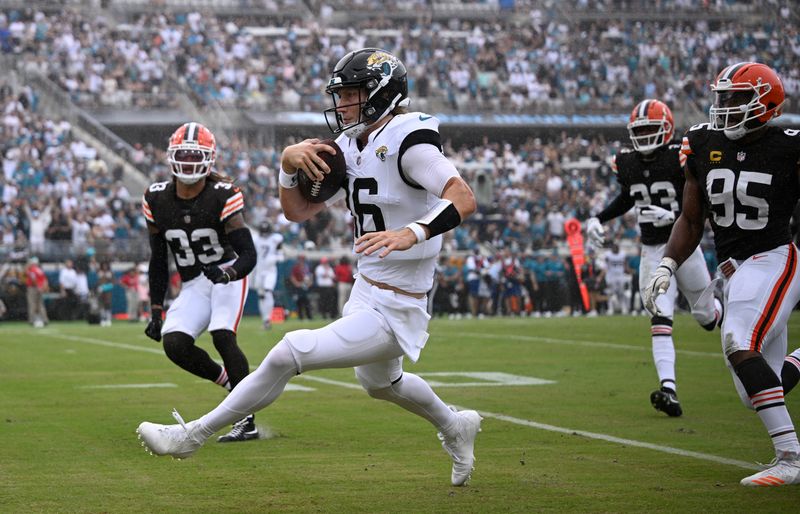 Jacksonville Jaguars quarterback Trevor Lawrence (16) rushes against the Cleveland Browns during the first half of an NFL football game Sunday, Sept. 15, 2024, in Jacksonville, Fla. (AP Photo/Phelan M. Ebenhack)