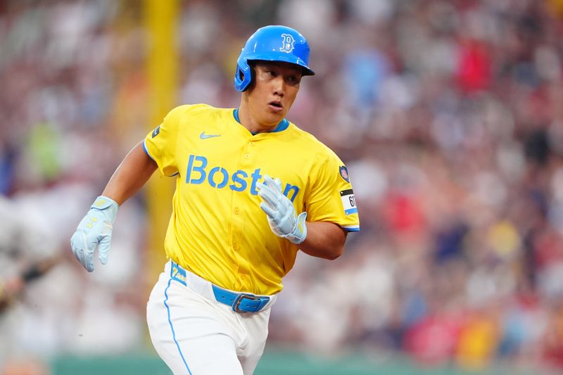 Jul 27, 2024; Boston, Massachusetts, USA;  Boston Red Sox designated hitter Masataka Yoshida (7) advances to third base on Boston Red Sox third baseman Rafael Devers (not pictured) single against the New York Yankees during the first inning at Fenway Park. Mandatory Credit: Gregory Fisher-USA TODAY Sports