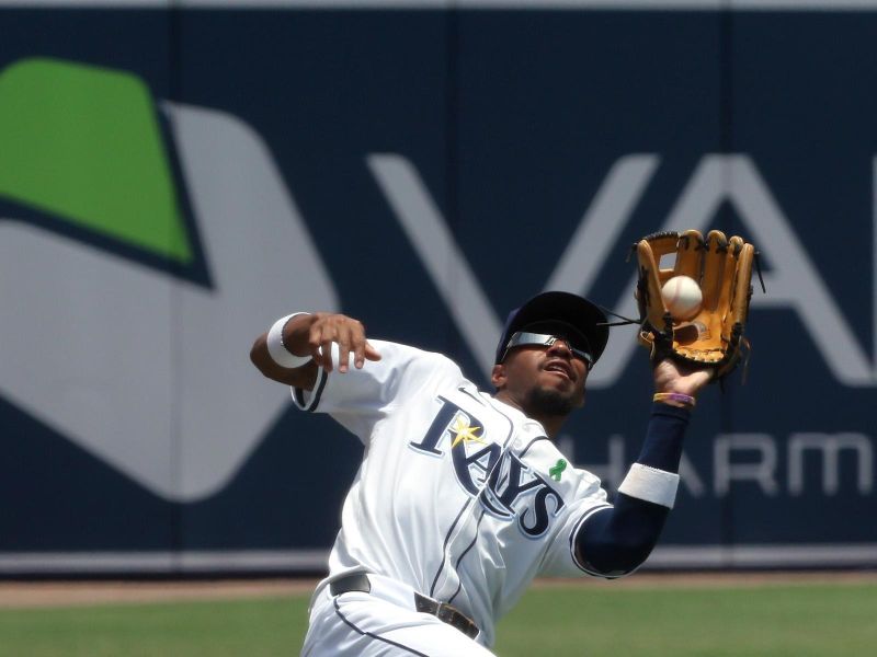 May 28, 2025; Minneapolis, Minnesota, USA;  Tampa Bay Rays outfielder Chandler Simpson (14) catches a fly ball during the first inning against the Minnesota Twins at George M. Steinbrenner Field. Mandatory Credit: Kim Klement Neitzel-Imagn Images
