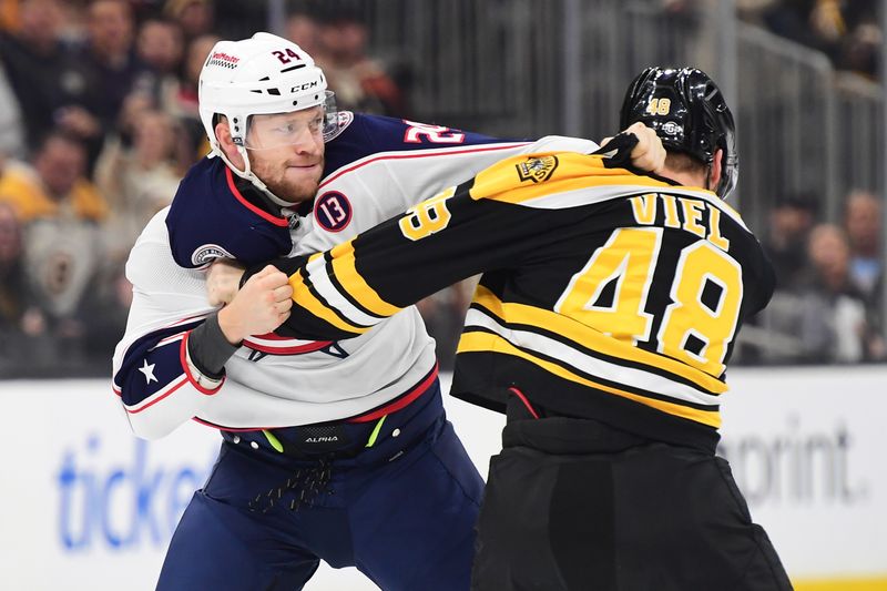 Nov 18, 2024; Boston, Massachusetts, USA;  Columbus Blue Jackets right wing Mathieu Olivier (24) fights with Boston Bruins left wing Jeffrey Viel (48) during the first period at TD Garden. Mandatory Credit: Bob DeChiara-Imagn Images