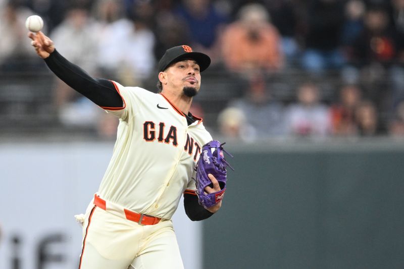 Jun 4, 2025; San Francisco, California, USA;  San Francisco Giants shortstop Willy Adames (2) throws to first base for an out against the San Diego Padres in the third inning at Oracle Park. Mandatory Credit: Eakin Howard-Imagn Images
