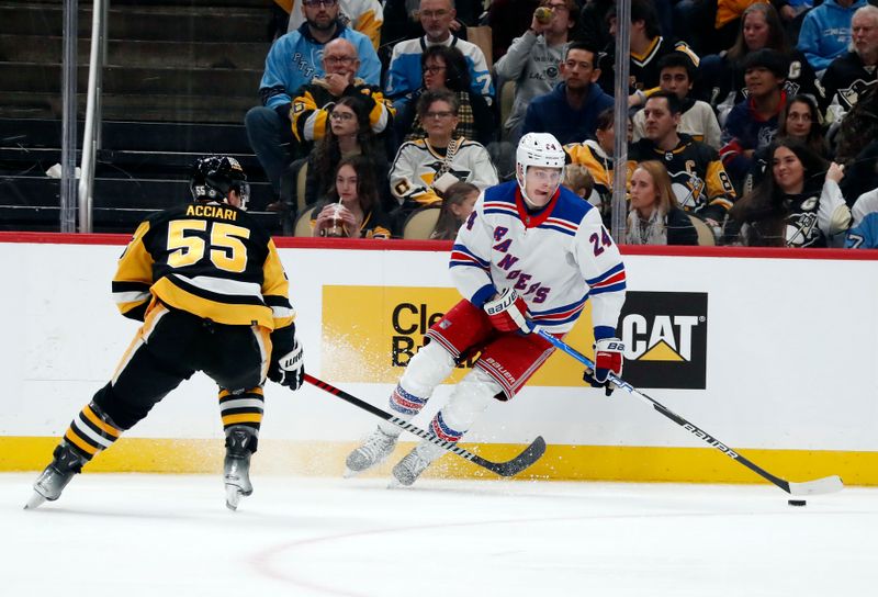 Nov 22, 2023; Pittsburgh, Pennsylvania, USA; New York Rangers right wing Kaapo Kakko (24) handles the puck against Pittsburgh Penguins center Noel Acciari (55) during the second period at PPG Paints Arena. Mandatory Credit: Charles LeClaire-USA TODAY Sports