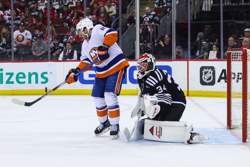 Apr 15, 2024; Newark, New Jersey, USA; New York Islanders center Kyle Palmieri (21) scores a goal on New Jersey Devils goaltender Jake Allen (34) during the first period at Prudential Center. Mandatory Credit: Ed Mulholland-USA TODAY Sports