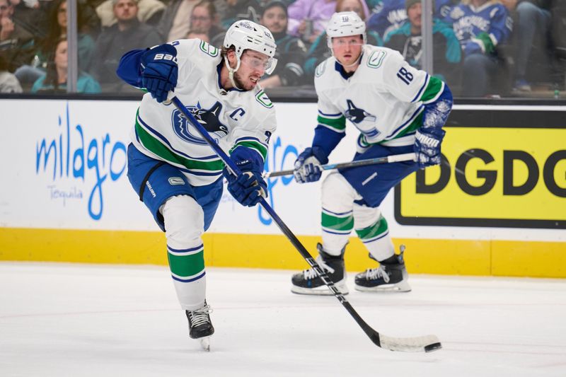 Nov 25, 2023; San Jose, California, USA; Vancouver Canucks defenseman Quinn Hughes (43) shoots the puck against the San Jose Sharks during the third period at SAP Center at San Jose. Mandatory Credit: Robert Edwards-USA TODAY Sports