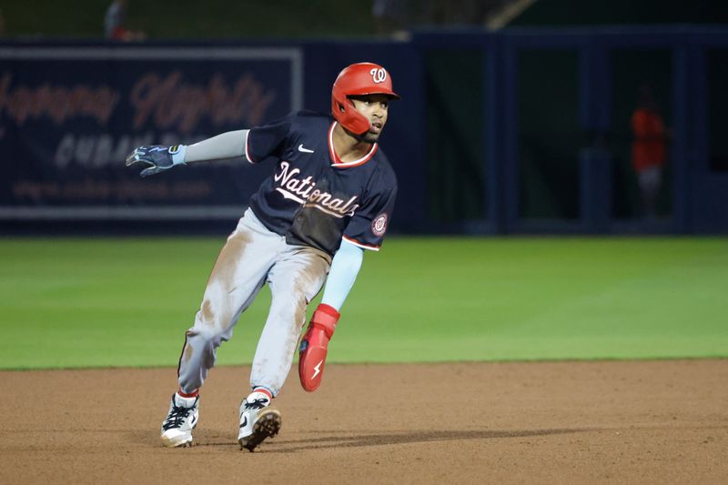 Mar 18, 2024; West Palm Beach, Florida, USA; Washington Nationals shortstop Nasim Nunez (26) holds up after rounding second base during the seventh inning against the Houston Astros at The Ballpark of the Palm Beaches. Mandatory Credit: Reinhold Matay-USA TODAY Sports