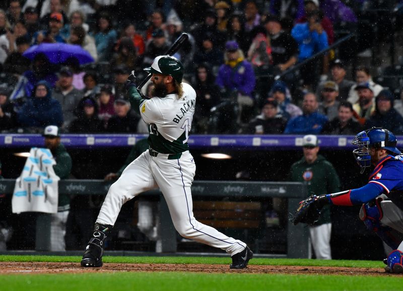 May 11, 2024; Denver, Colorado, USA; Colorado Rockies outfielder Charlie Blackmon (19) hits a double against the Texas Rangers during the seventh inning at Coors Field. Mandatory Credit: John Leyba-USA TODAY Sports