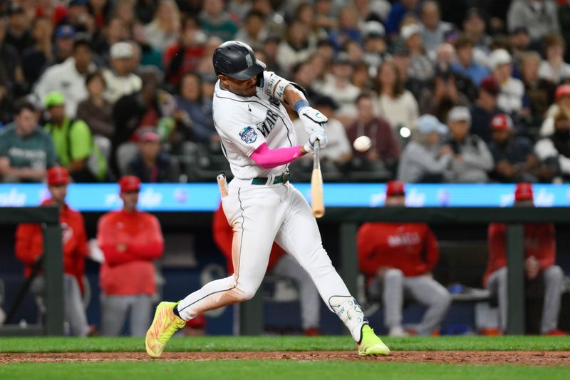 Sep 11, 2023; Seattle, Washington, USA; Seattle Mariners center fielder Julio Rodriguez (44) hits a double against the Los Angeles Angels during the sixth inning at T-Mobile Park. Mandatory Credit: Steven Bisig-USA TODAY Sports