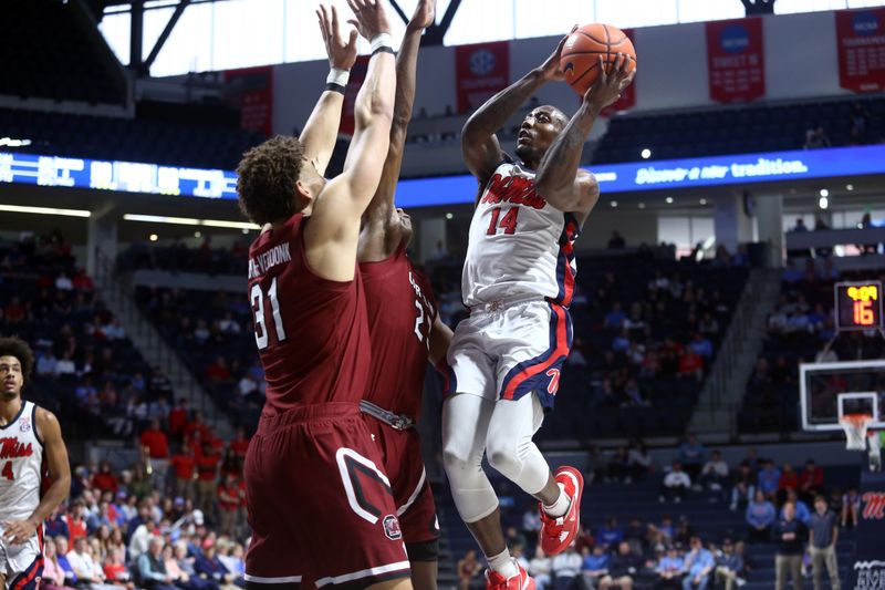 Feb 11, 2023; Oxford, Mississippi, USA; Mississippi Rebels guard Tye Fagan (14) shoots during the second half against the South Carolina Gamecocks at The Sandy and John Black Pavilion at Ole Miss. Mandatory Credit: Petre Thomas-USA TODAY Sports