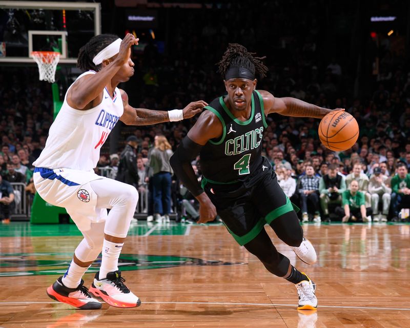 BOSTON, MA - JANUARY 27: Jrue Holiday #4 of the Boston Celtics handles the ball during the game against the LA Clippers on January 27, 2024 at the TD Garden in Boston, Massachusetts. NOTE TO USER: User expressly acknowledges and agrees that, by downloading and or using this photograph, User is consenting to the terms and conditions of the Getty Images License Agreement. Mandatory Copyright Notice: Copyright 2024 NBAE  (Photo by Brian Babineau/NBAE via Getty Images)