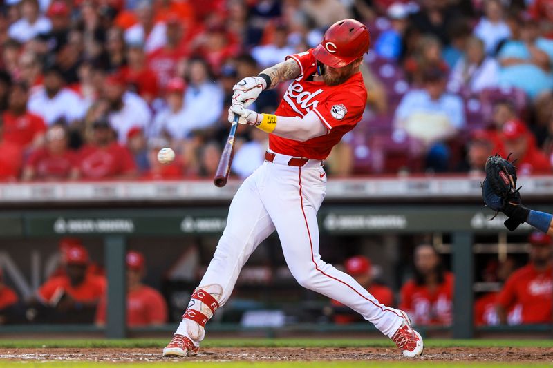 Sep 2, 2024; Cincinnati, Ohio, USA; Cincinnati Reds outfielder Jake Fraley (27) hits a single in the fifth inning against the Houston Astros at Great American Ball Park. Mandatory Credit: Katie Stratman-USA TODAY Sports