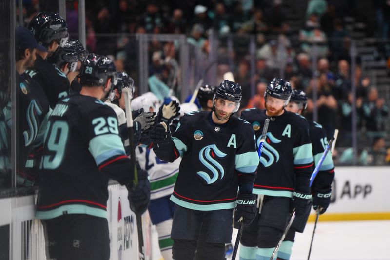 Feb 22, 2024; Seattle, Washington, USA; Seattle Kraken right wing Jordan Eberle (7) celebrates with the bench after scoring a goal against the Vancouver Canucks during the third period at Climate Pledge Arena. Mandatory Credit: Steven Bisig-USA TODAY Sports