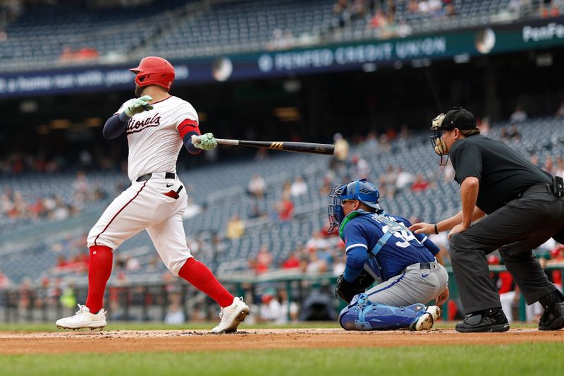 Sep 26, 2024; Washington, District of Columbia, USA; Washington Nationals first baseman Juan Yepez (18) hits an RBI single against the Kansas City Royals during the first inning at Nationals Park. Mandatory Credit: Geoff Burke-Imagn Images