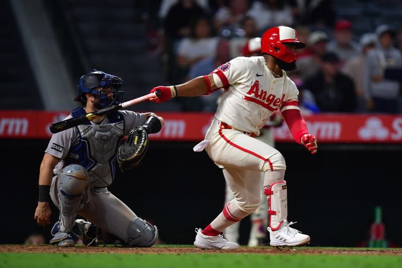 May 27, 2025; Anaheim, California, USA; Los Angeles Angels second baseman Luis Rengifo (2) hits a single against the New York Yankees during the ninth inning at Angel Stadium. Mandatory Credit: Gary A. Vasquez-Imagn Images