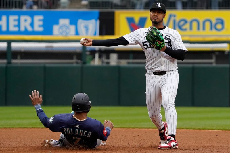 May 21, 2025; Chicago, Illinois, USA; Chicago White Sox second base Lenyn Sosa (50) forces out Seattle Mariners third base Jorge Polanco (7) at second base during the seventh inning at Rate Field. Mandatory Credit: David Banks-Imagn Images