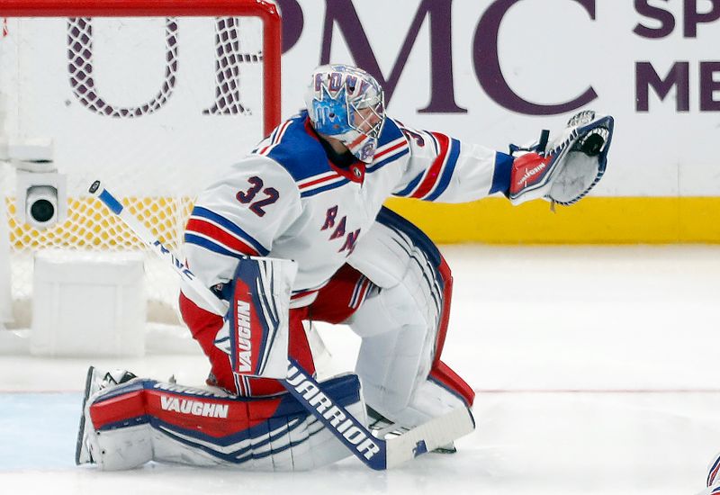 Mar 16, 2024; Pittsburgh, Pennsylvania, USA;  New York Rangers goaltender Jonathan Quick (32) makes a glove save against the Pittsburgh Penguins during the third period at PPG Paints Arena. New York won 7-4. Mandatory Credit: Charles LeClaire-USA TODAY Sports