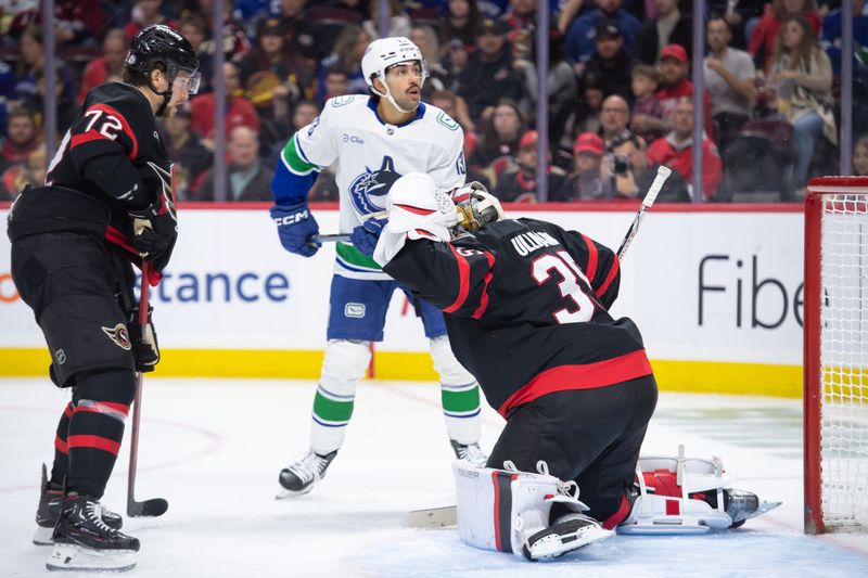 Nov 23, 2024; Ottawa, Ontario, CAN; Vancouver Canucks left wing Arshdeep Bains (13) follows the puck after a save by Ottawa Senators goalie Linus Ullmark (35) in the second period at the Canadian Tire Centre. Mandatory Credit: Marc DesRosiers-Imagn Images