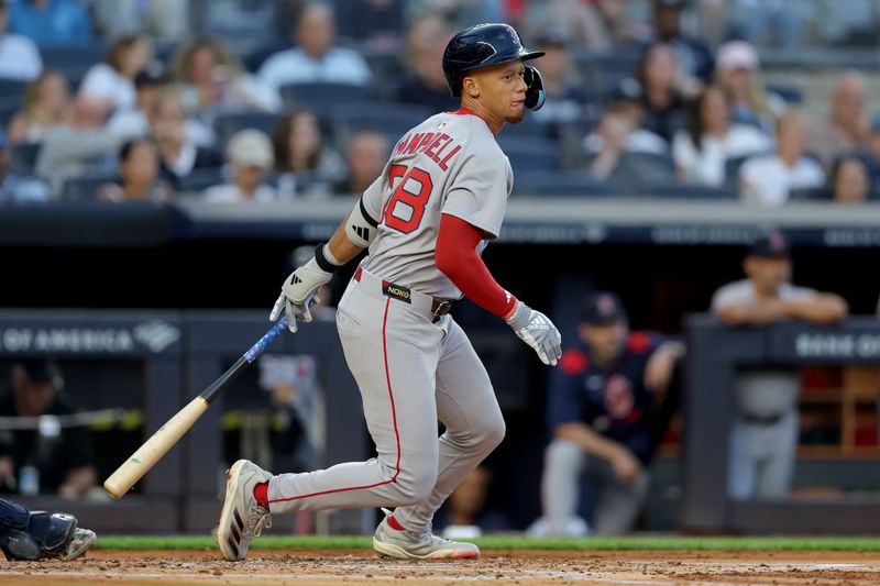 Jun 7, 2025; Bronx, New York, USA; Boston Red Sox second baseman Kristian Campbell (28) follows through on an RBI single against the New York Yankees during the second inning at Yankee Stadium. Mandatory Credit: Brad Penner-Imagn Images