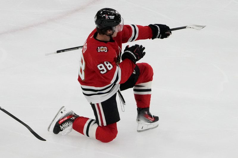 Oct 28, 2025; Chicago, Illinois, USA; Chicago Blackhawks center Connor Bedard (98) celebrates his hat trick against the Ottawa Senators during the third period at United Center. Mandatory Credit: David Banks-Imagn Images
