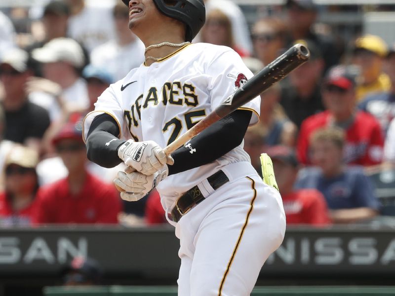 Jul 19, 2023; Pittsburgh, Pennsylvania, USA;  Pittsburgh Pirates catcher Endy Rodriguez (25) hits a single to record the first major league hit of his career against the Cleveland Guardians during the seventh inning at PNC Park. Mandatory Credit: Charles LeClaire-USA TODAY Sports