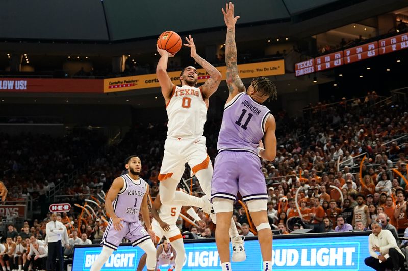 Jan 3, 2023; Austin, Texas, USA; Texas Longhorns forward Timmy Allen (0) shoots over Kansas State Wildcats forward Keyontae Johnson (11) during the first half at Moody Center. Mandatory Credit: Scott Wachter-USA TODAY Sports