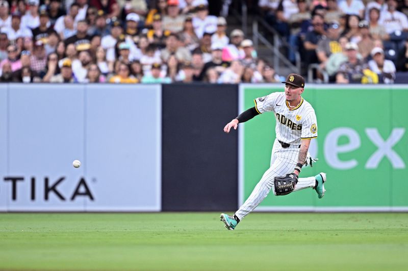 Jul 6, 2024; San Diego, California, USA; San Diego Padres center fielder Jackson Merrill (3) fields a ball during the second inning against the Arizona Diamondbacks at Petco Park. Mandatory Credit: Orlando Ramirez-USA TODAY Sports