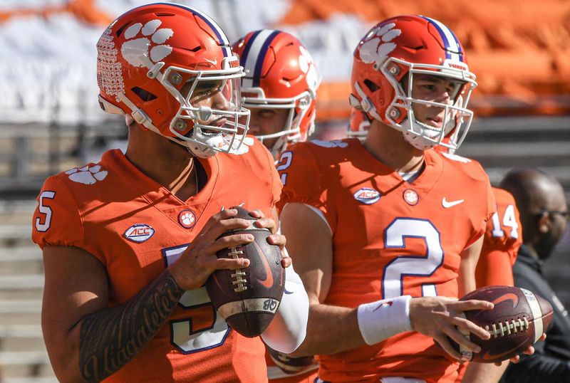 Nov 26, 2022; Clemson, SC, USA; Clemson quarterback D.J. Uiagalelei (5) and quarterback Cade Klubnik (2) warm up before the game between South Carolina and Clemson at Memorial Stadium in Clemson, S.C. Saturday, Nov. 26, 2022.    Mandatory Credit: Ken Ruinard-USA TODAY Sports