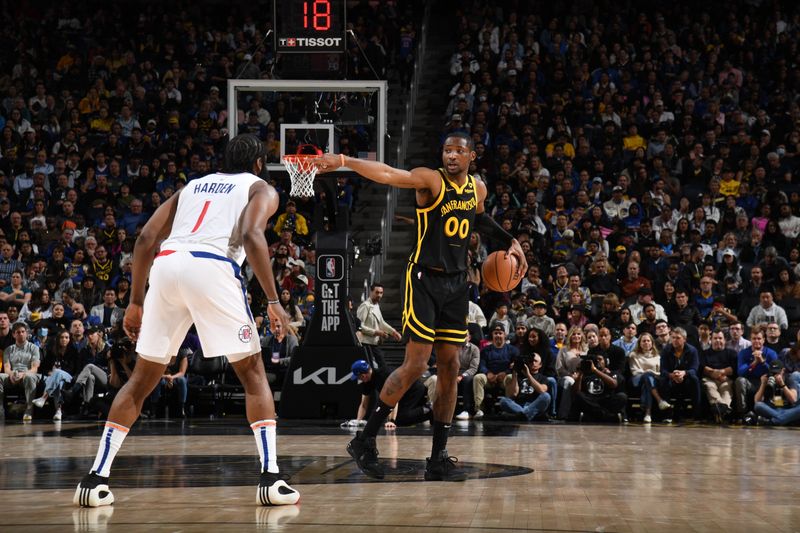 SAN FRANCISCO, CA - FEBRUARY 14: Jonathan Kuminga #00 of the Golden State Warriors dribbles the ball during the game against the LA Clippers on FEBRUARY 14, 2024 at Chase Center in San Francisco, California. NOTE TO USER: User expressly acknowledges and agrees that, by downloading and or using this photograph, user is consenting to the terms and conditions of Getty Images License Agreement. Mandatory Copyright Notice: Copyright 2024 NBAE (Photo by Noah Graham/NBAE via Getty Images)